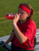 Young girl drinking after sports