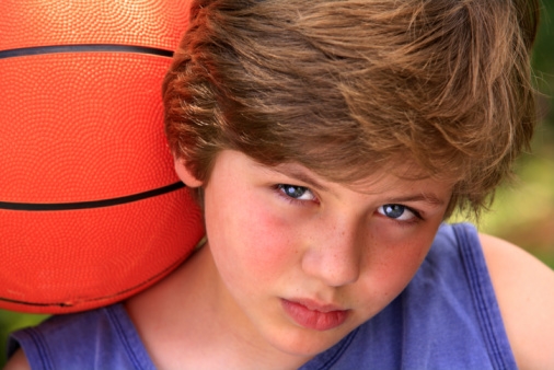 Homesick boy at basketball camp