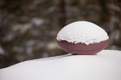 Football covered with snow
