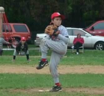 Youth baseball pitcher in the windup