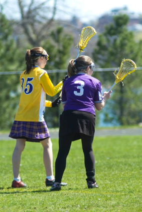 Girls' lacrosse players in action