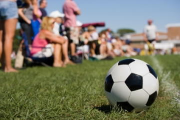Soccer ball and parents on sideline