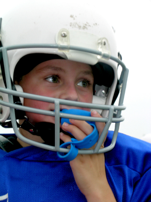 Young football player with mouthguard