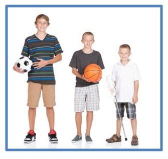 Three boys of different ages with different balls