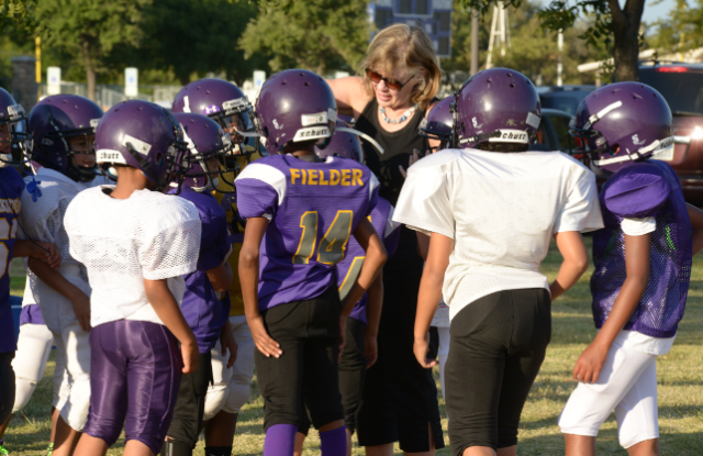 Brooke de Lench and Grand Prairie youth football players