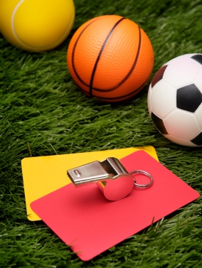 Volleyball, basketball, soccer ball, official's whistle and caution cards