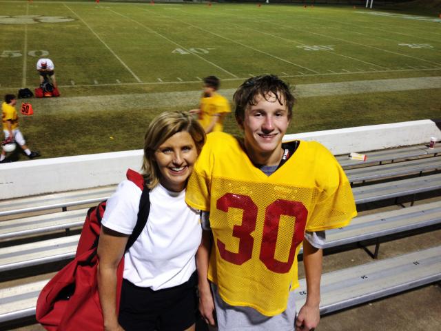 Gretchen Rose and son after first 7th grade football game